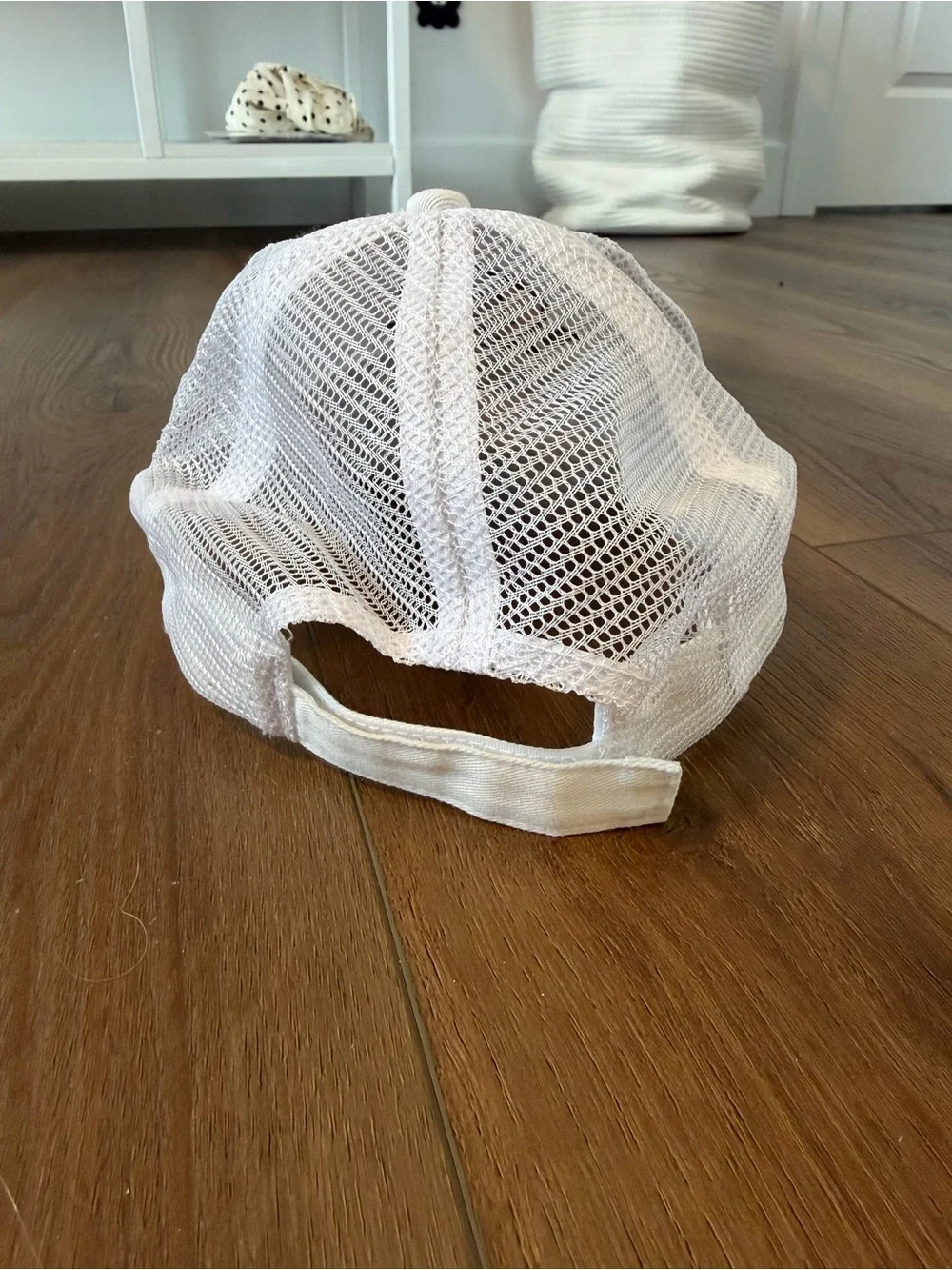 White Mesh-Back Hat with Yellow Smiley Patch